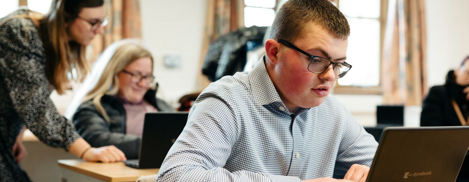 Students in classroom receiving study support