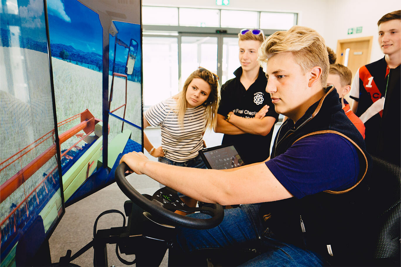 Agriculture student on mechanical tractor