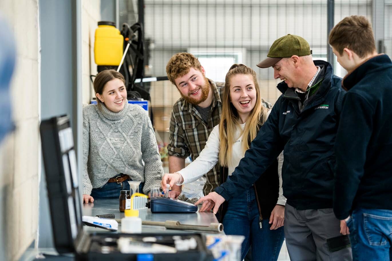 Agriculture students learning about soil testing