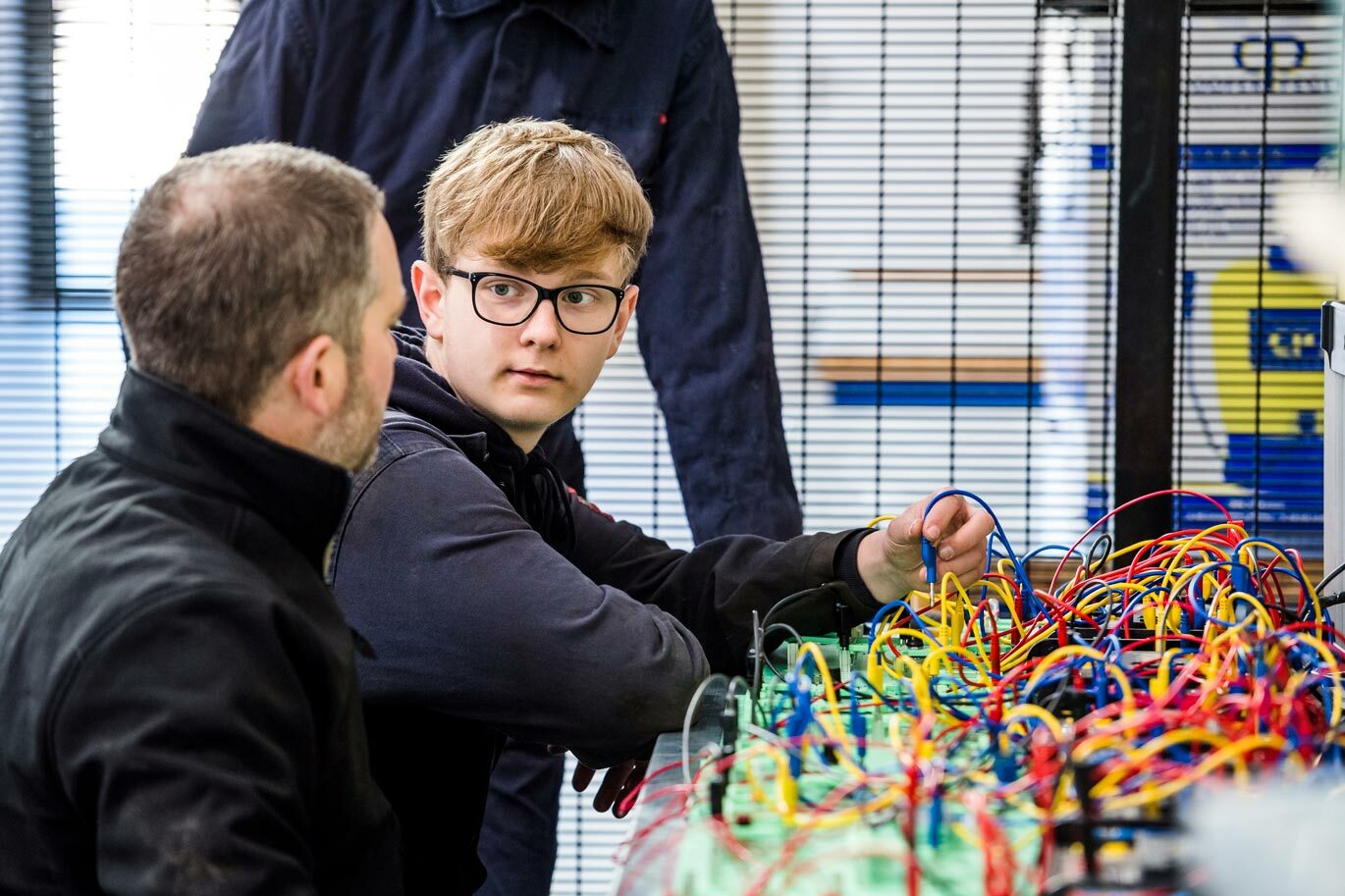 Engineering student working on circuit board in Centre for Agri Food Technology