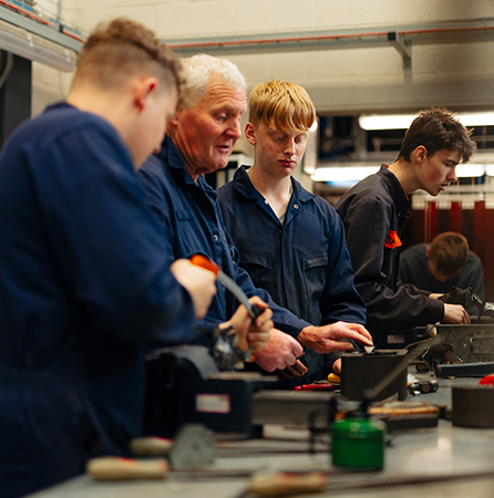Engineering students learning from expert tutor thumb
