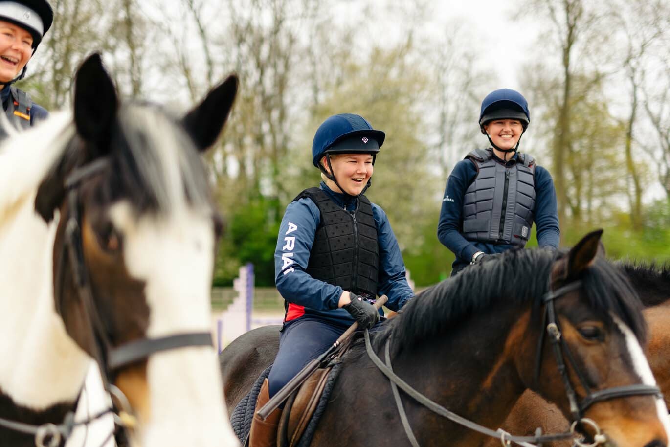 Equine callout Equine students on horseback laughing