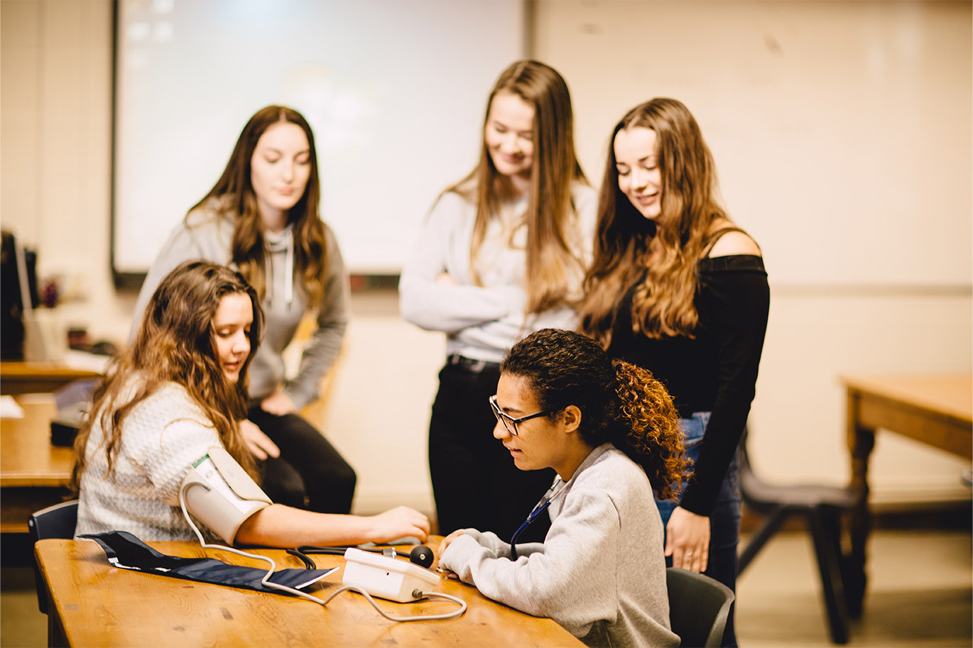 Health and Social Care students taking blood pressure