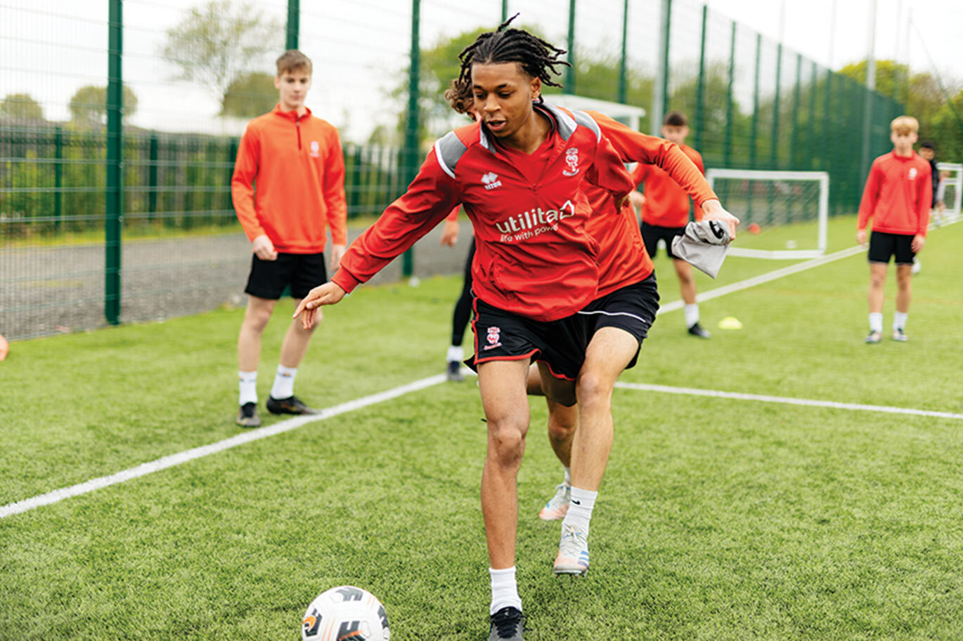 Lincoln City Shadow Academy playing football