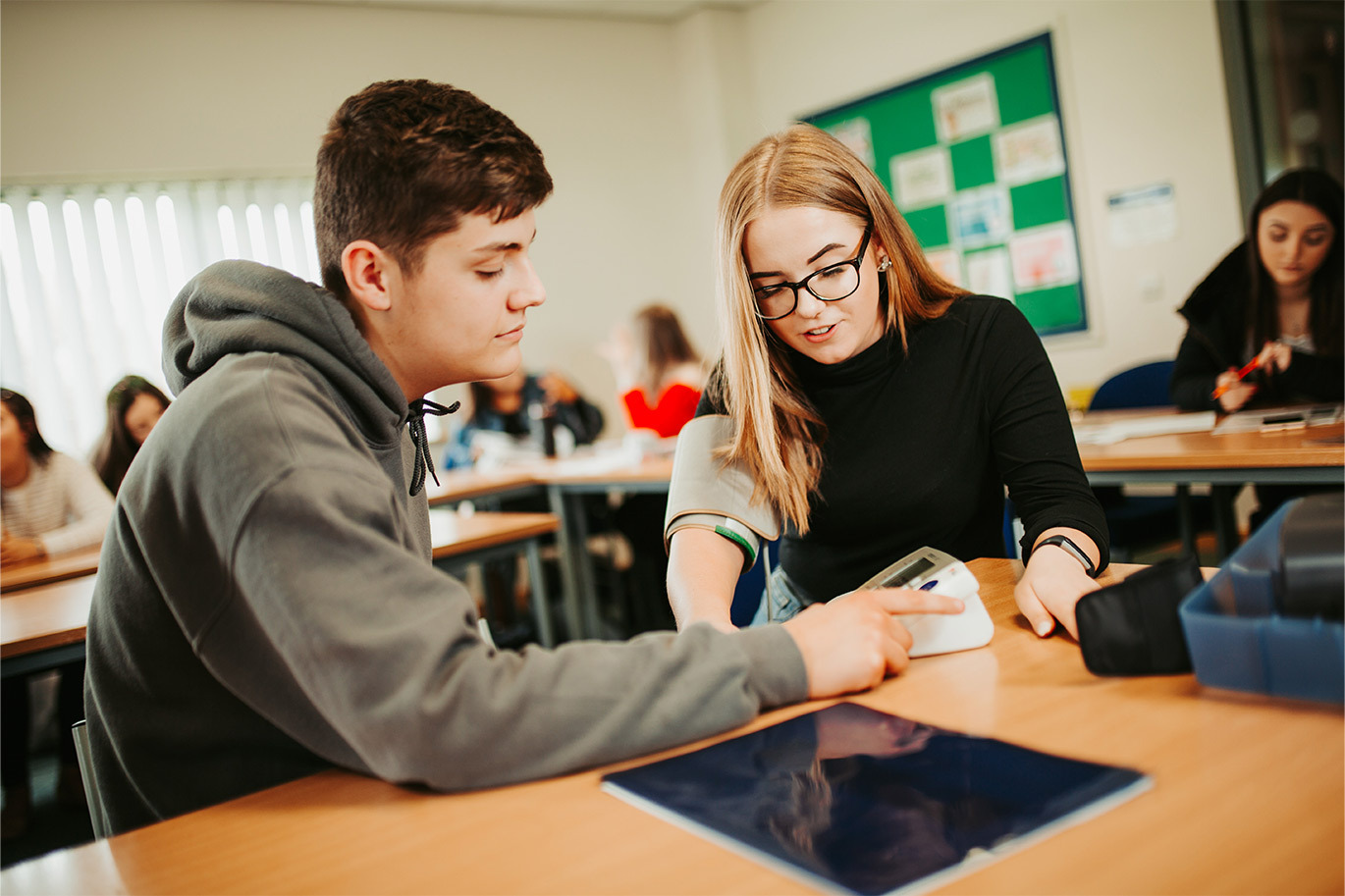 Students on Health and Social Care course taking blood pressure