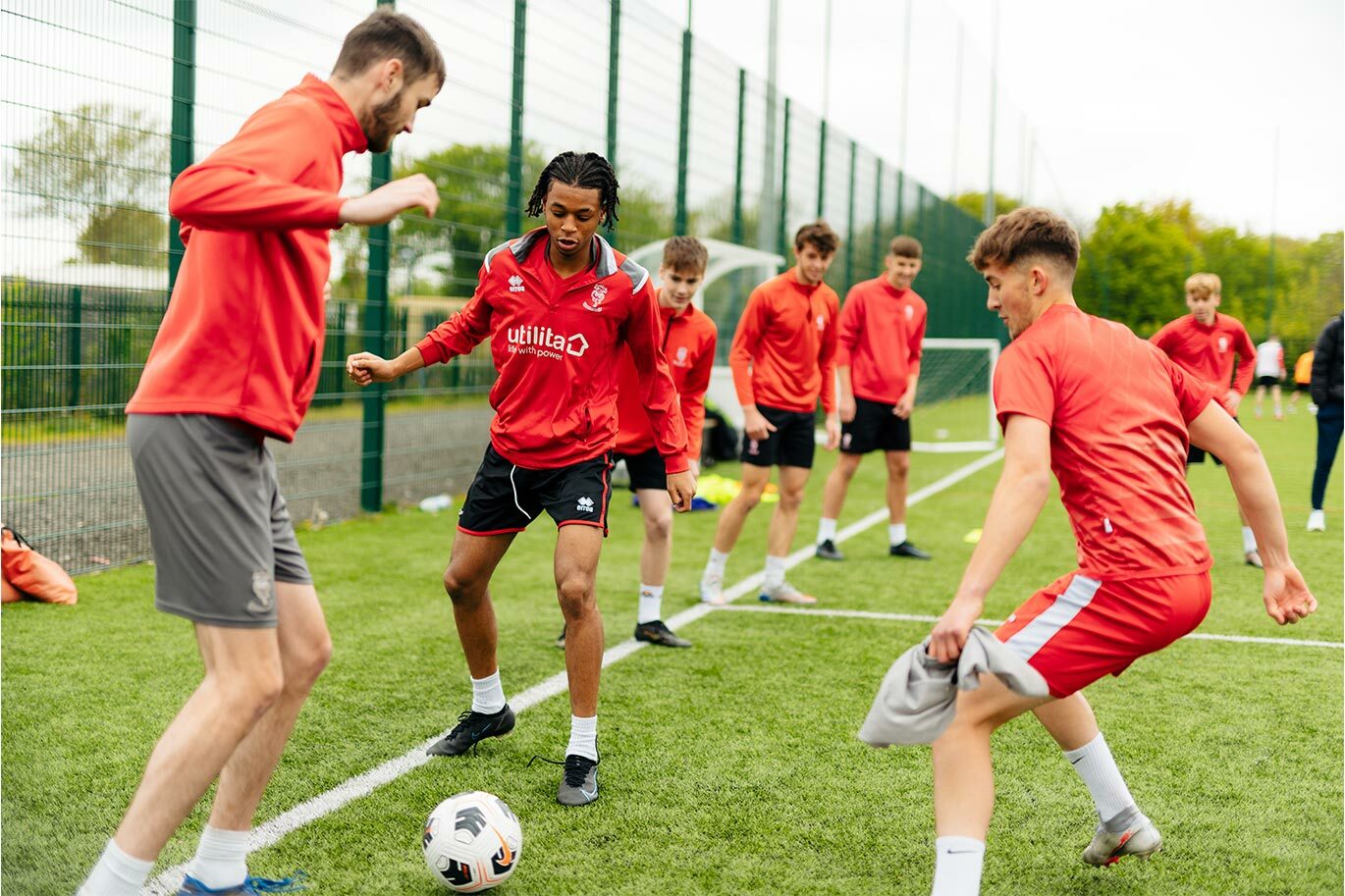 Students on the lincoln academy football training